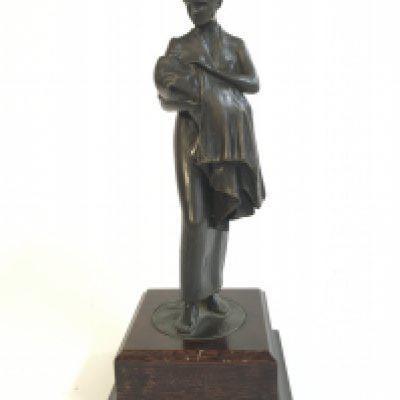 A bronze figure of a lady nursing a baby , 25cm tall. Postage category B