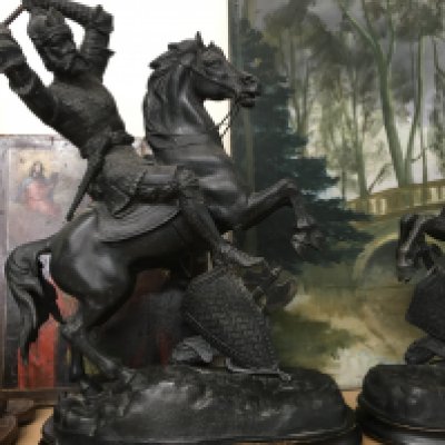 A pair of spelter figures in the form of warriors on rearing horses. 45 cm
