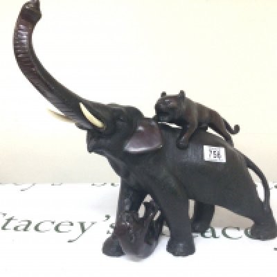 A Japanese late 19th Century bronze of an elephant being attacked by tigers. Hight 40cm