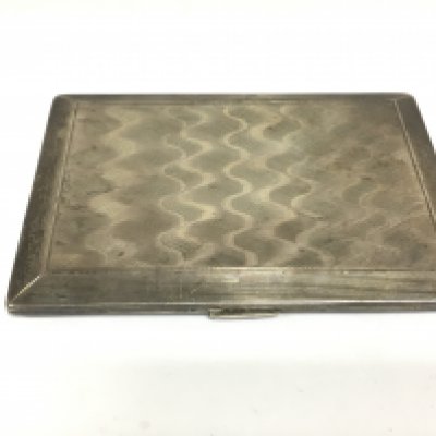 A silver cigarette case with engine turned decoration, Birmingham hallmarks. Shipping category A.