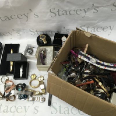 A large box of mixed watches including Ted baker Fossil etc Postage B