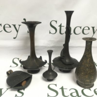 Four small bronze bud vases and a bell. Shipping category B.