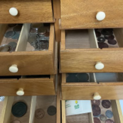 A small cabinet of mixed British coinage