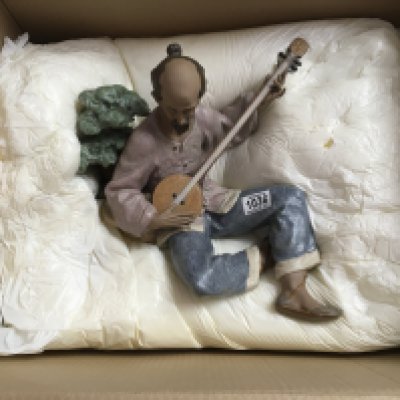 WITHDRAWN - A large boxed Lladro figure of an oriental gentleman playing an instrument. 38cm in height approximately. No obvious damage or restoration