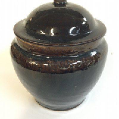 A Chinese tenmoku glaze lidded jar, 18cm tall approximately.