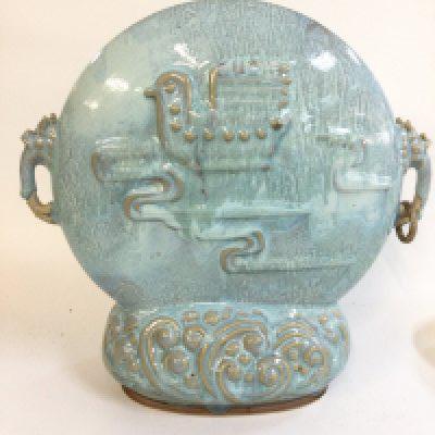 A Chinese porcelain centrepiece vase , decorated in relief with birds . 33cm tall 34cm wide approximately