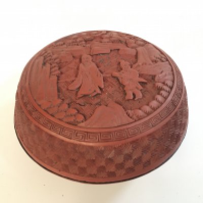 A Chinese red cinnabar round box . 7cm tall. Postage category A
