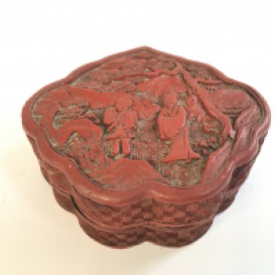 A Chinese red cinnabar box ,11cm wide . Postage category A