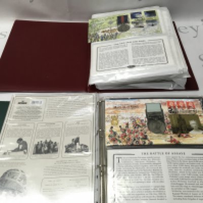 Two folders of stamp and medal presentation packs. Postage B