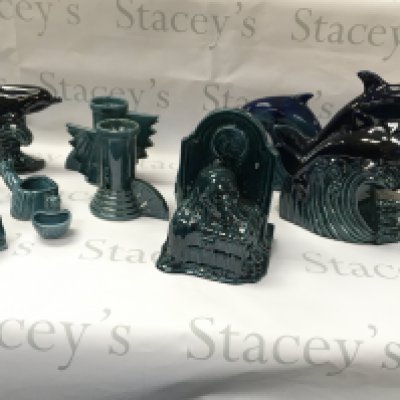 A collection of turquoise and black ceramics including dolphins tombstone etc. No reserve.