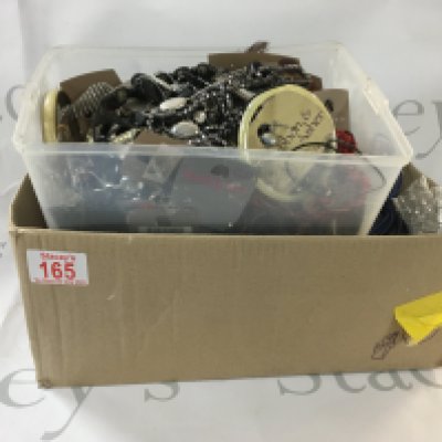 Box of jewellery which includes bracelets, necklaces, earrings, and more.