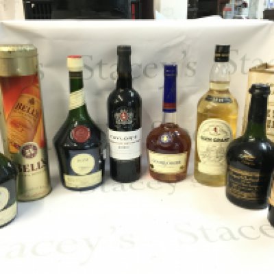 A collection of spirits including Dom Benedictine, Cognac Courvoisier, Glen Grant scotch whisky, Bisquit Dubouch & co cognac etc