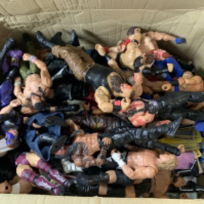 A collection of Pokemon cards, including a sealed Sun and Moon Cosmic Eclipse Unseen Depths theme deck, and WWE figurines.