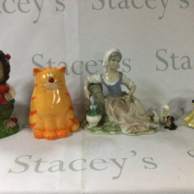 A box including a range of antiques and also a wide range of cutlery and lamps and dishes and some other antiques.