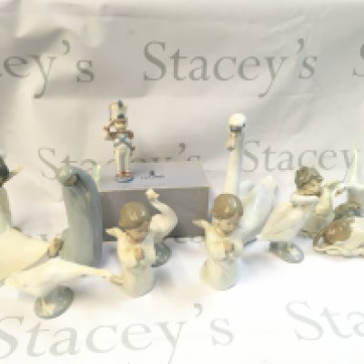 A Collection of porcelain Lladro figures including Toy Solider Christmas ornament, angel children, swans and geese