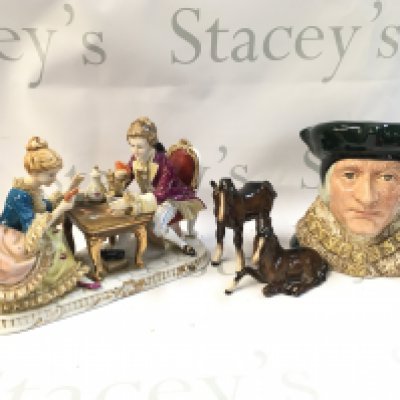 A Collection of ceramics including a German classical style card players figure group, two Beswick horses and a Sir Thomas More character jug