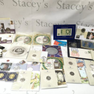 A collection of coinage including uncirculated coin sets and a number of commemorative 50p. Postage B