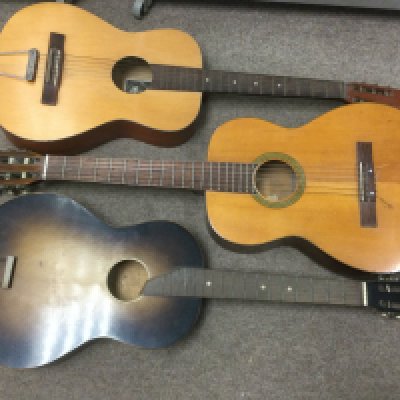 Three acoustic guitars.