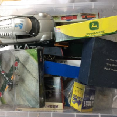 A collection of antique cars, planes and vehicles. Most items still include boxes.