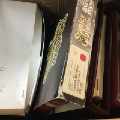A collection of stamp albums made by Stanley Gibbon including the One Country Stamp Album, Cover Album, 2 Great British Stamp albums, some other stamp albums and a small box of vintage postcards