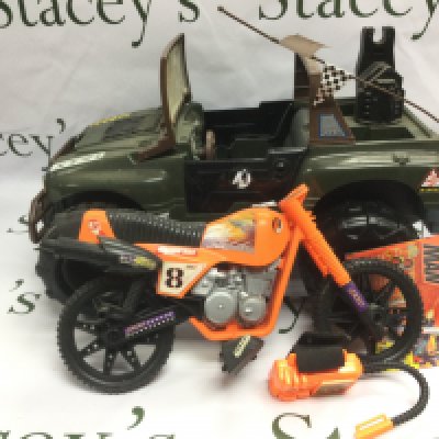 A box of Action Man toys.