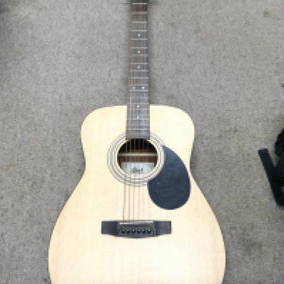A Cort acoustic guitar , model AF510 NS