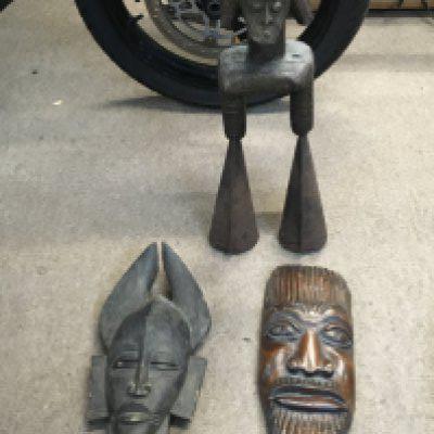 Two African hardwood wall masks and an African figure/