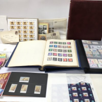 A large collection of stamp albums and loose stamps and stamp sheets. Postage C. NO RESERVE
