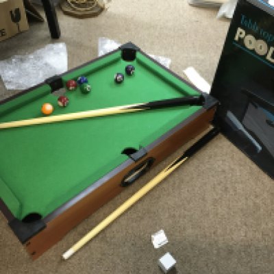 A tabletop pool table
