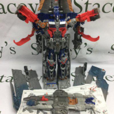 A Transformers Optimus Prime figure and a collection of Star Trek vehicles.