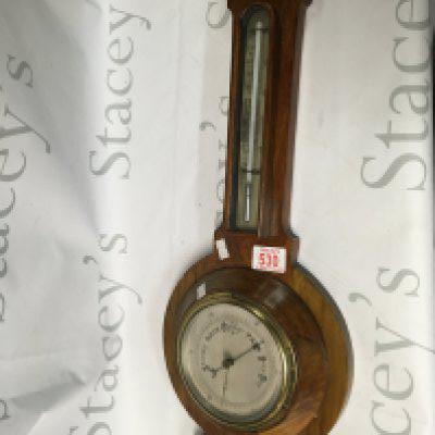 An antique barometer clock.
