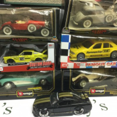 A box of boxed die cast vehicles, mainly 1/18 scale plus a box of Mega Blocks construction models (2),