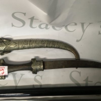 A collection of an Indian sword stick and an antique curved dagger.