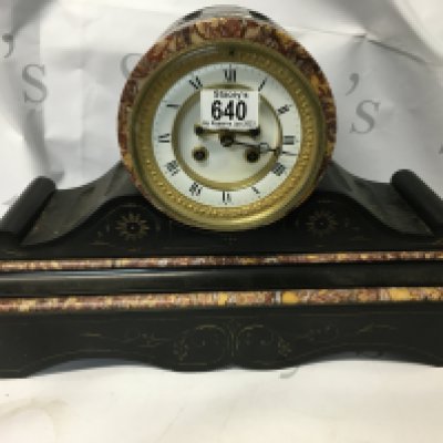 An antique Victorian marble mantle clock. A slate mantle clock with Roman numeral face. 45 cm by 30cm approximately.