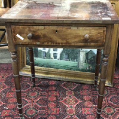 A late George III mahogany side table the rectangular top above a single drawer on ring turned legs terminating in brass casters. Length 60cm. NO RESERVE