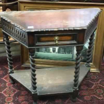 An oak side table with a shaped edge above a single drawer on barley twist legs united by an under shelf 85cm. NO RESERVE