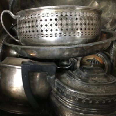 A collection of silver plate including dishes, candlestick and and antique Victorian pot.