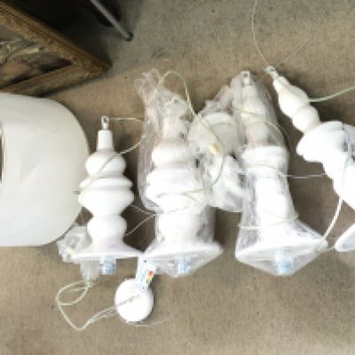 Four ceramic Karman hanging lamps and a large shade.