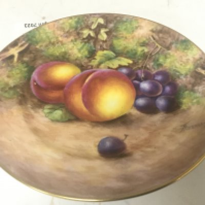 A Royal Worcester hand painted porcelain plate study of fruit and foliage signed Freeman and a box containing WH Goss china. (2)