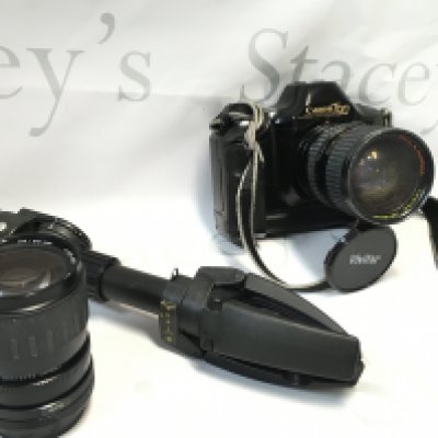 A Canon T50 camera with a Bell & Howell 80mm lens, Vivitar 80mm lens