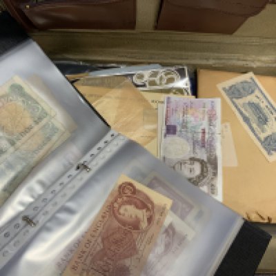 A collection of vintage world and spoof banknotes.