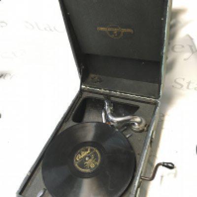 A portable gramophone with Spankys Magic Piano records , seen working