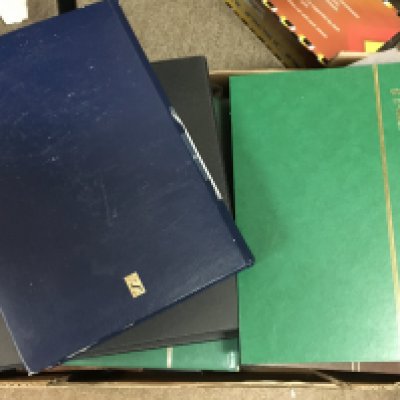 A Collection of world stamp albums containing used and unused stamps from Romania, Venezuela, Yugoslavia, USA, GB etc