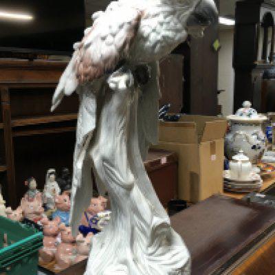 A large Italian porcelain parrot figure, damaged. 52cm tall approximately