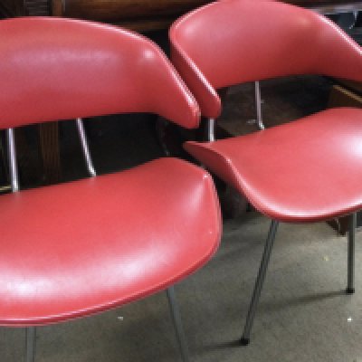 A set of four modern design chairs with tapering chrome legs