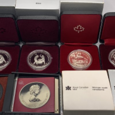 Royal Canadian Mint, 7 Silver commemorative cased coins.