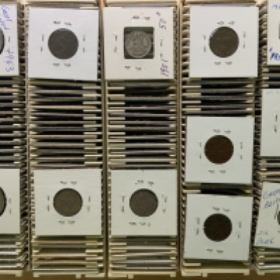 A collection of British coinage of various denominations.