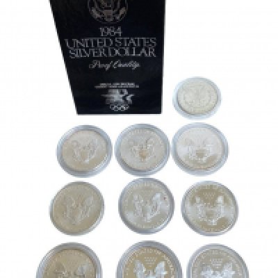 A collection of American 1 Dollar pieces. 1881 Morgan Dollar, 1984 Proof boxed, Bullion 1Ounce fine silver, 2000, 2005 with Paper label overlay decoration, 5 x 2011 (Matt Proof/ 1 Mirror finish), 2019, 2021. (A)
