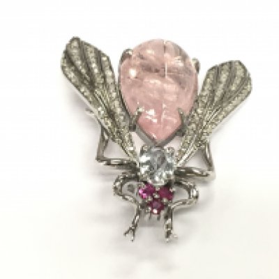 A silver fly brooch / pendant set with pear shaped pink beryl an oval aquamarine rubies and diamonds. Aquamarines 12.10ct and diamonds 0.50ct some of the very small diamonds missing.