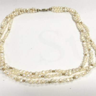 A three string pearl necklace. Approximately 47cm length. Postage A. NO RESERVE
